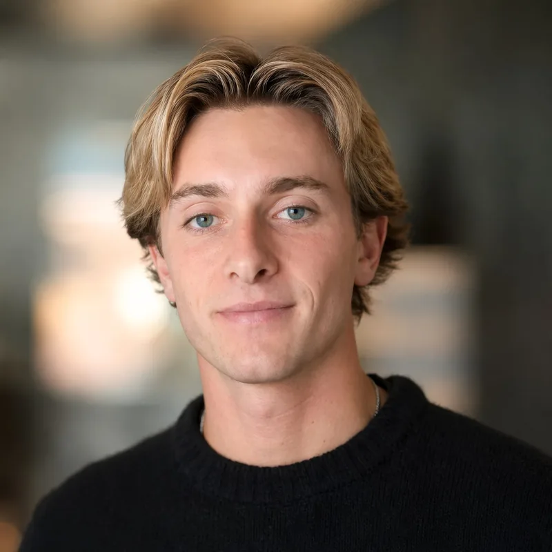 AI-generated professional founder headshot in a black sweater
