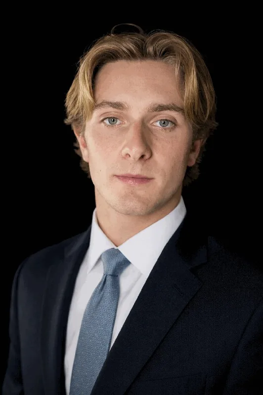 Executive portrait in navy suit with tie