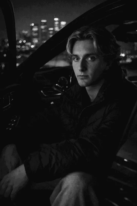 Black and white night portrait inside a car